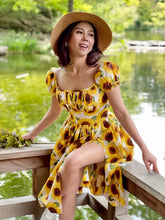 Load image into Gallery viewer, Girl_wearing_Suri_dress_sitting_the garden 

